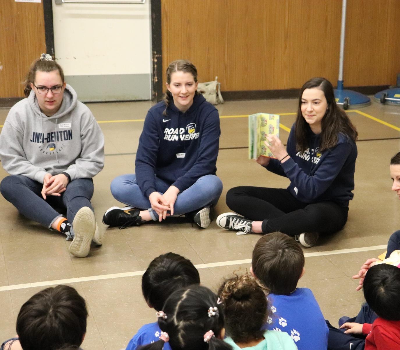 LBCC student-athletes Megan Ely, Jenaya Wright and Ellie Weber at Hoover Elementary.