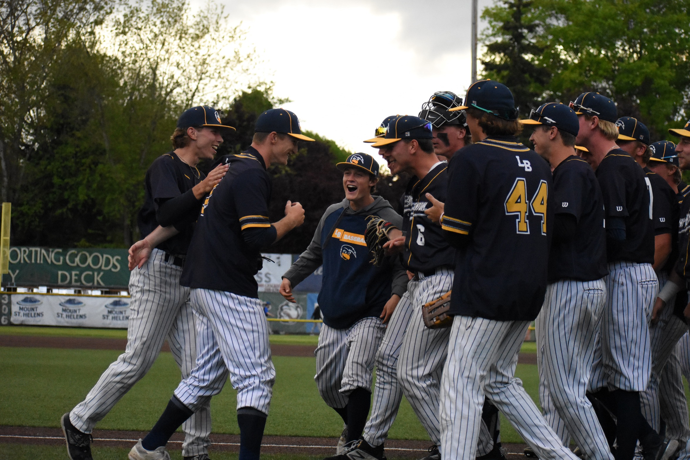 Kian Hogan is embraced by his teammates after an interview, following the Roadrunners 6-1 win. Hogan had a no-hitter through 6 innings, before allowing a hit in the seventh. Photo Courtesy: Carsyn Meyers